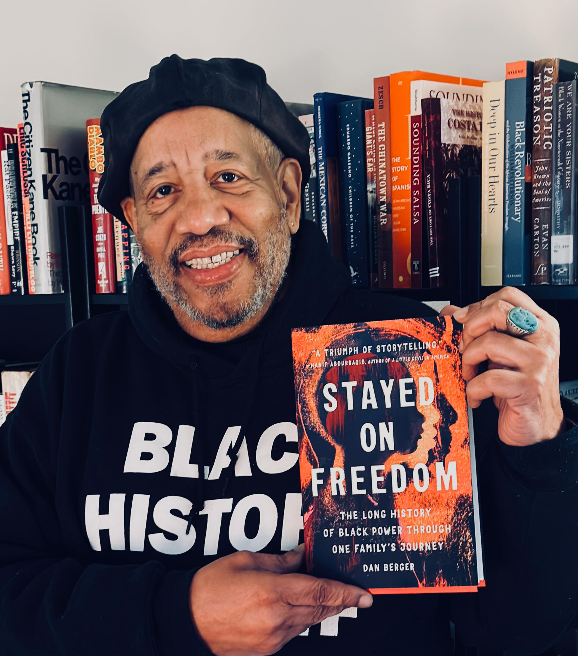 Michael_Stayed-on-Freedom Michael Simmons holding a copy of Stayed on Freedom